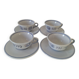 Glazed earthenware cups and saucers