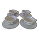 Glazed earthenware cups and saucers