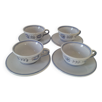 Glazed earthenware cups and saucers