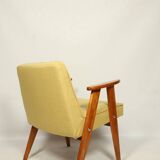 Fauteuil en laine jaune au design scandinave après rénovation