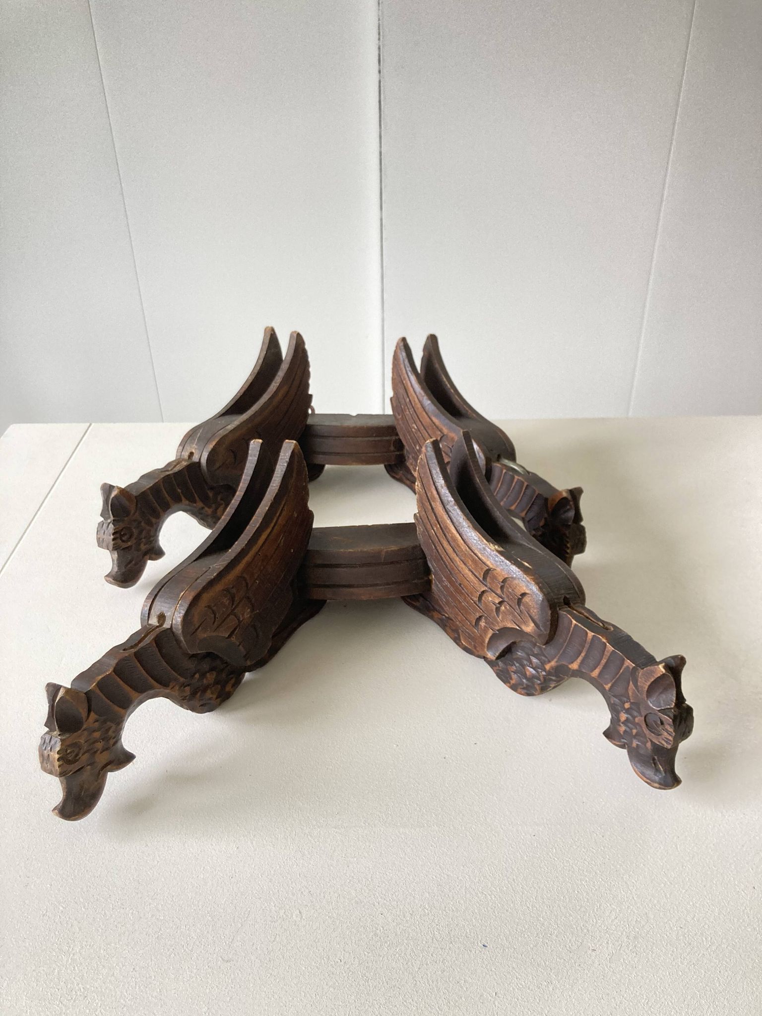Pair of winged dragon sconces in carved wood
