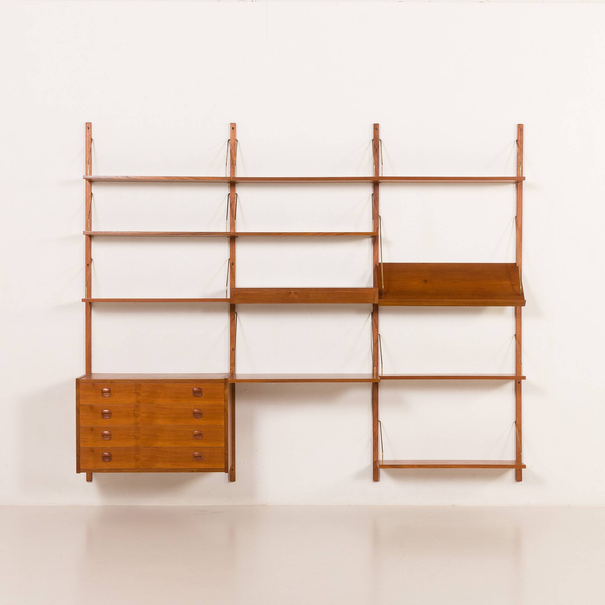 Danish teak wall unit in the style of Cadovius, Sorensen with a lamp, 1970s
