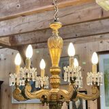 Golden wooden chandelier with crystal pendants from the 19th century.