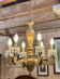 Golden wooden chandelier with crystal pendants from the 19th century.