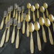23 seats: 12 forks, 11 spoons, silver metal, 2 punches