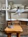 Swan neck lamp in metal and white opal.