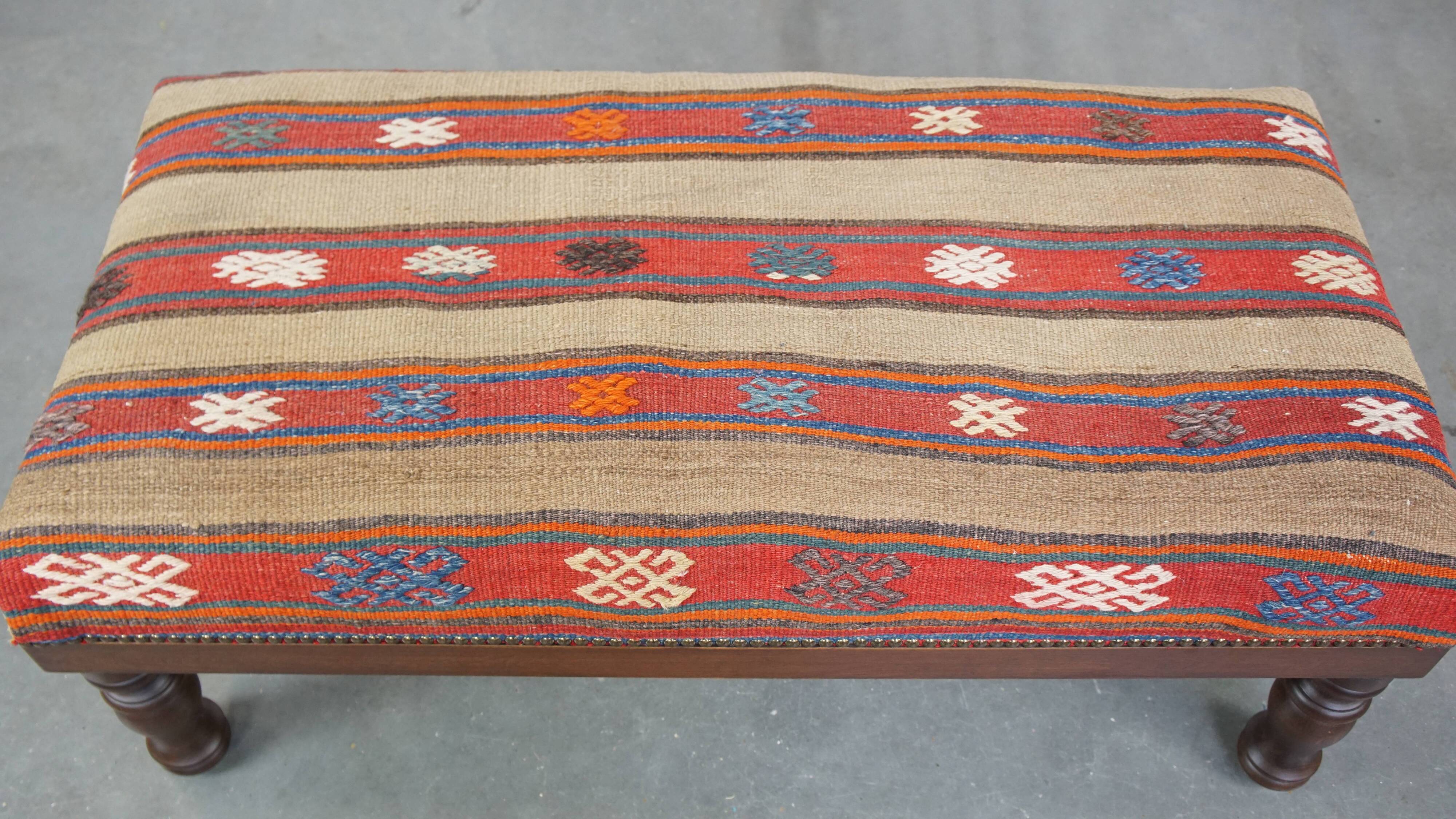 Oriental pouf upholstered in an antique kilim