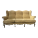 Louis XV style three-seater wingback sofa in patinated beech, 20th century