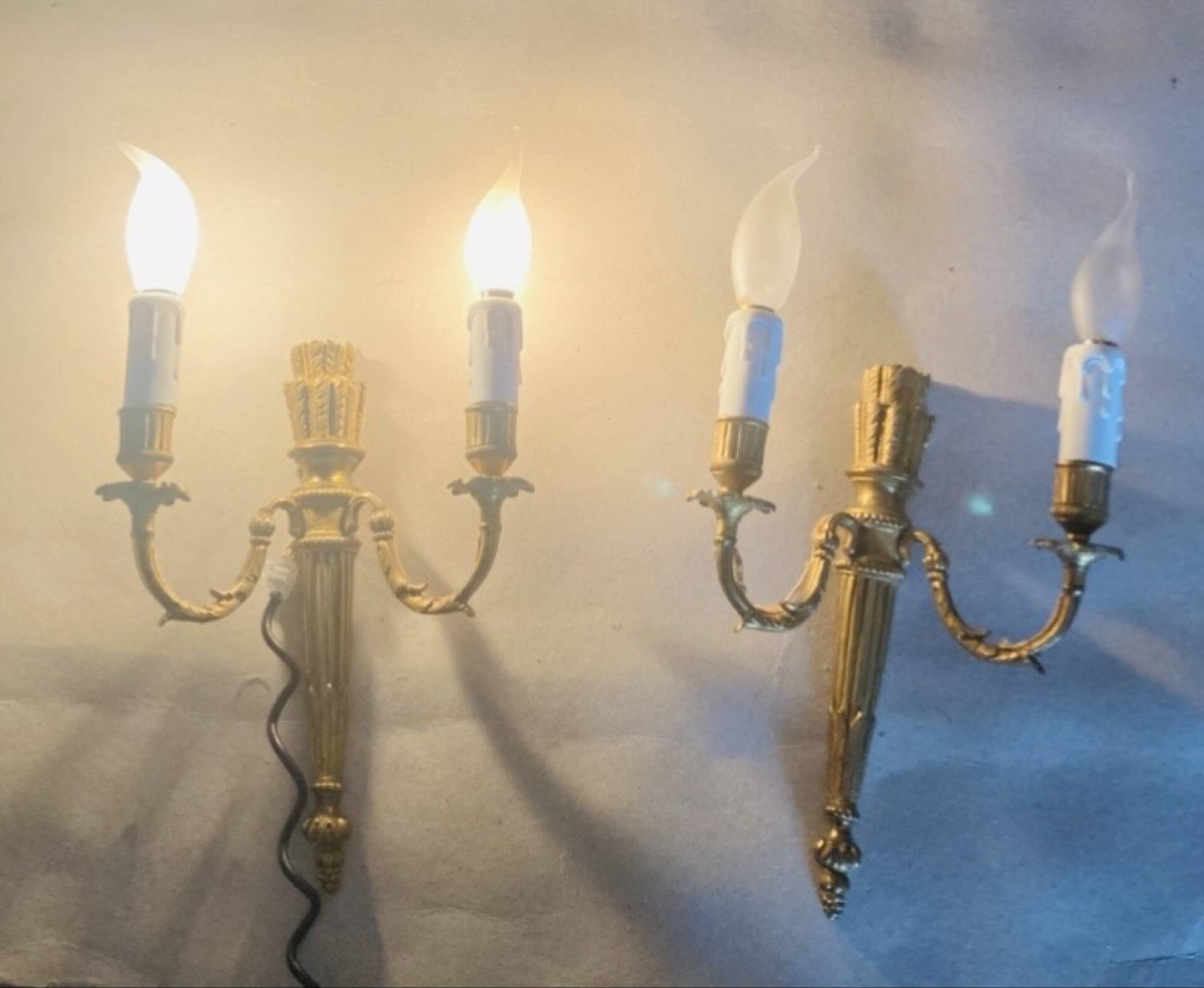 Louis XVI bronze wall sconces from the 19th century with quiver decorations.