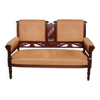 Old wooden and velvet bench