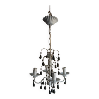 Antique white lacquered metal chandelier with wooden pendants.