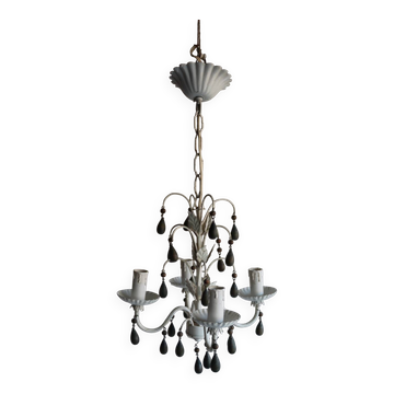 Antique white lacquered metal chandelier with wooden pendants.