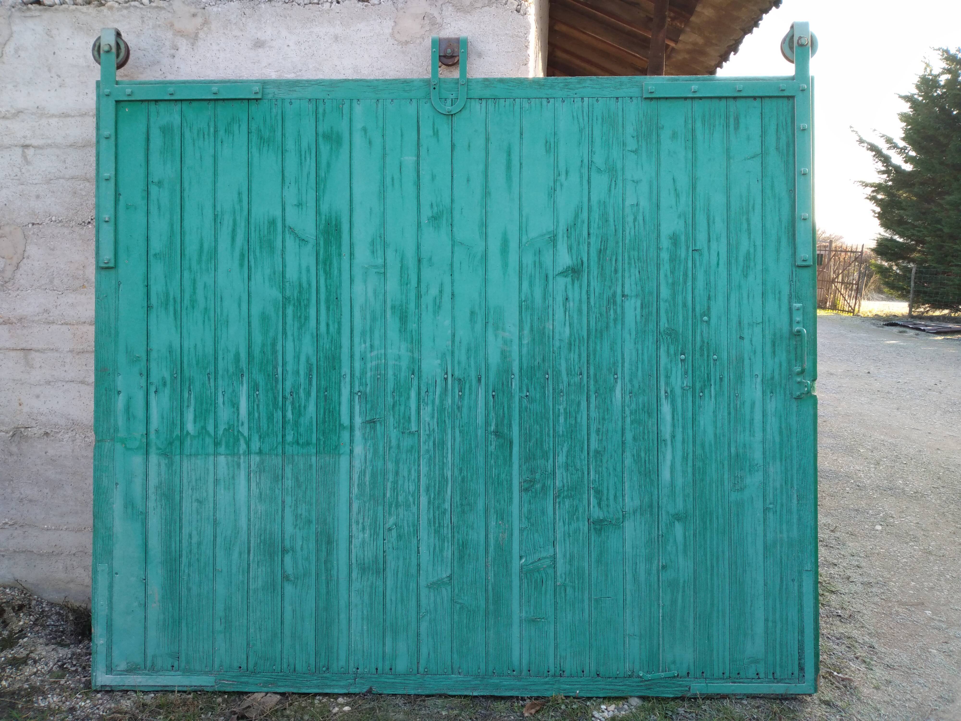 Old wooden door with pulley