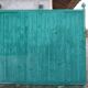 Old wooden door with pulley