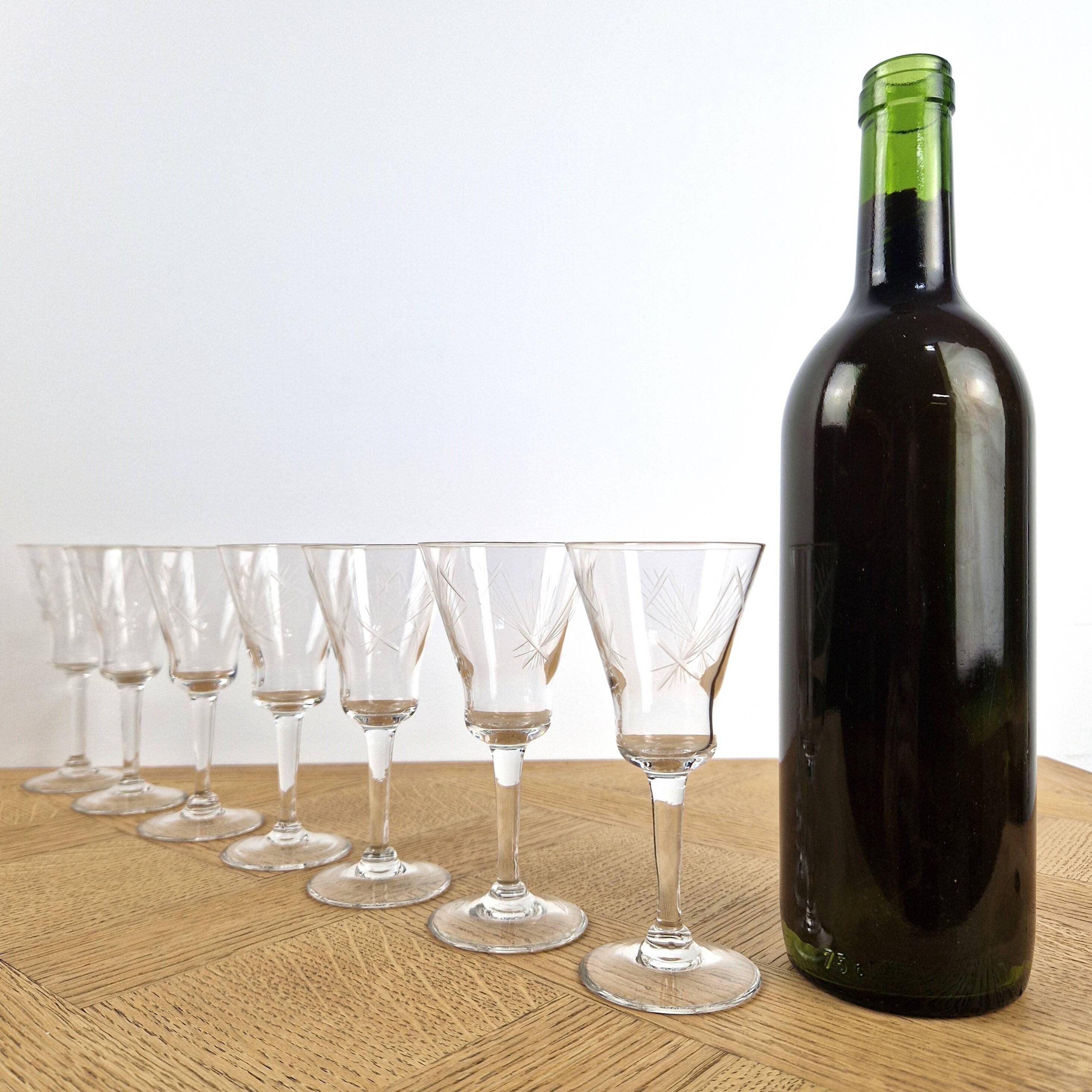 7 crystal footed glasses, antique white wine glasses.