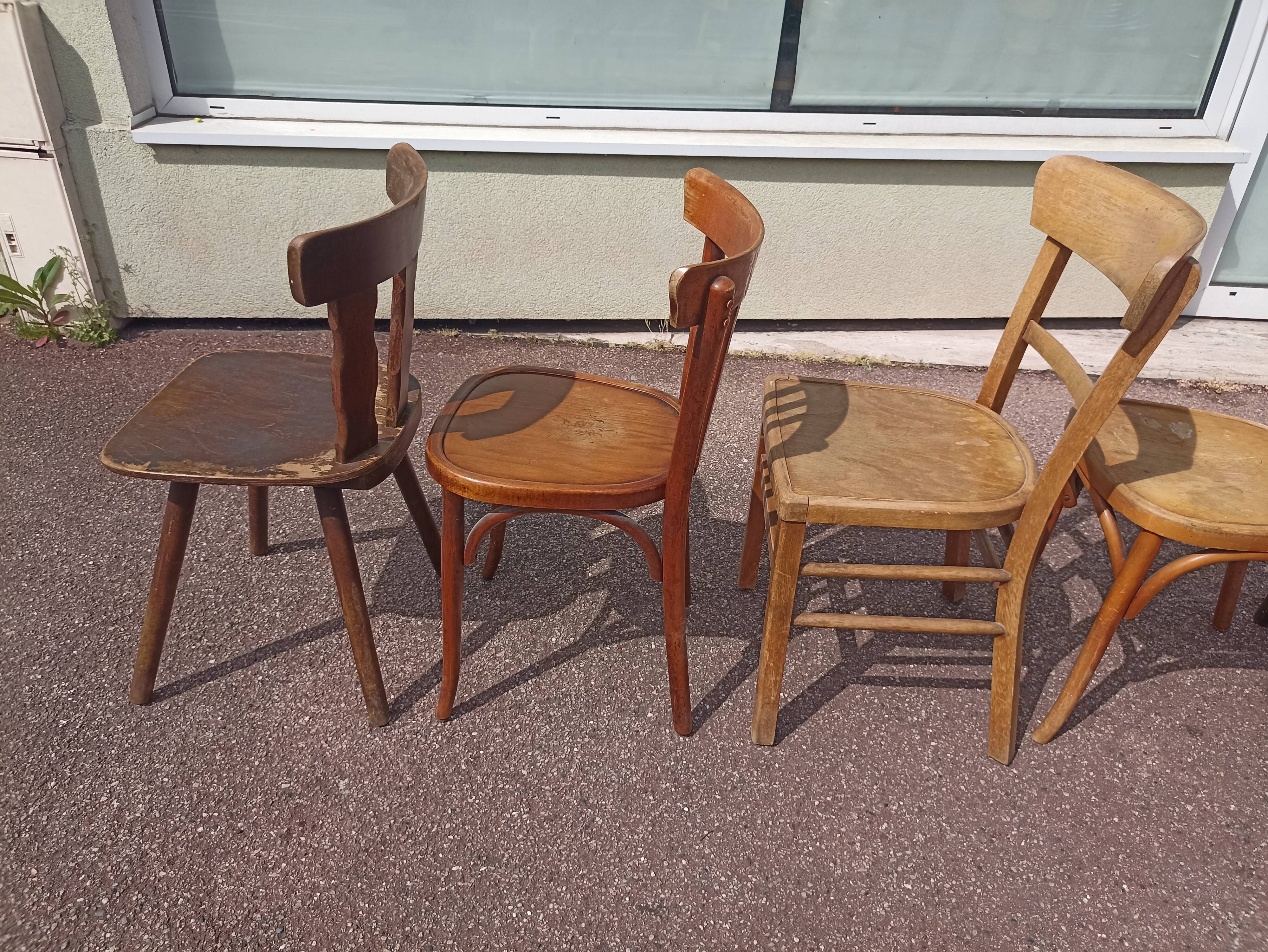 Set of 12 mismatched wooden bistro chairs