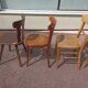 Set of 12 mismatched wooden bistro chairs