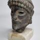 Head of Zeus in patinated plaster in imitation of bronze, 15 cm