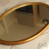 Oval gold mirror