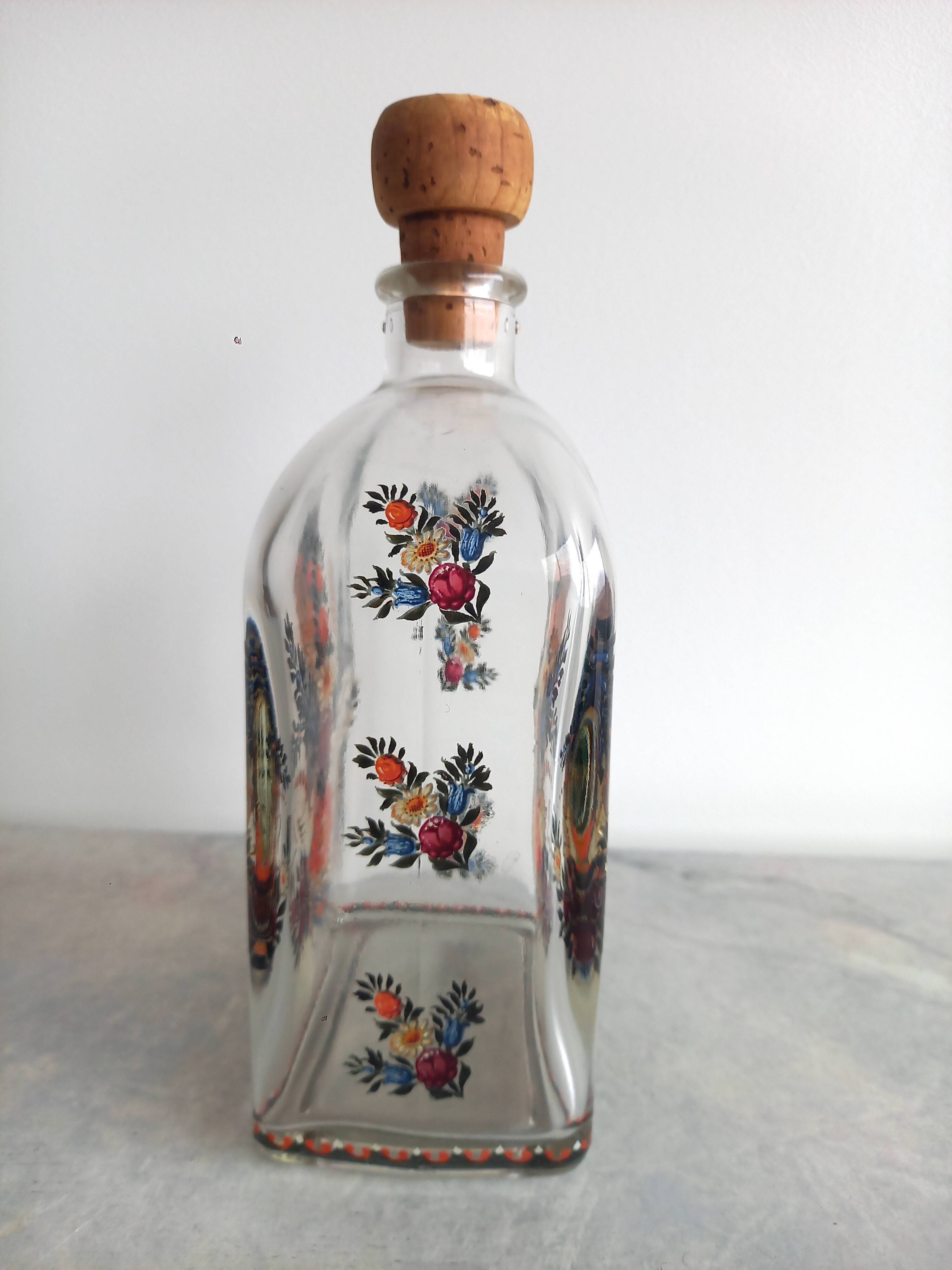 Bottle with folkloric decoration of flowers and birds inspired by Eastern countries