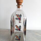 Bottle with folkloric decoration of flowers and birds inspired by Eastern countries