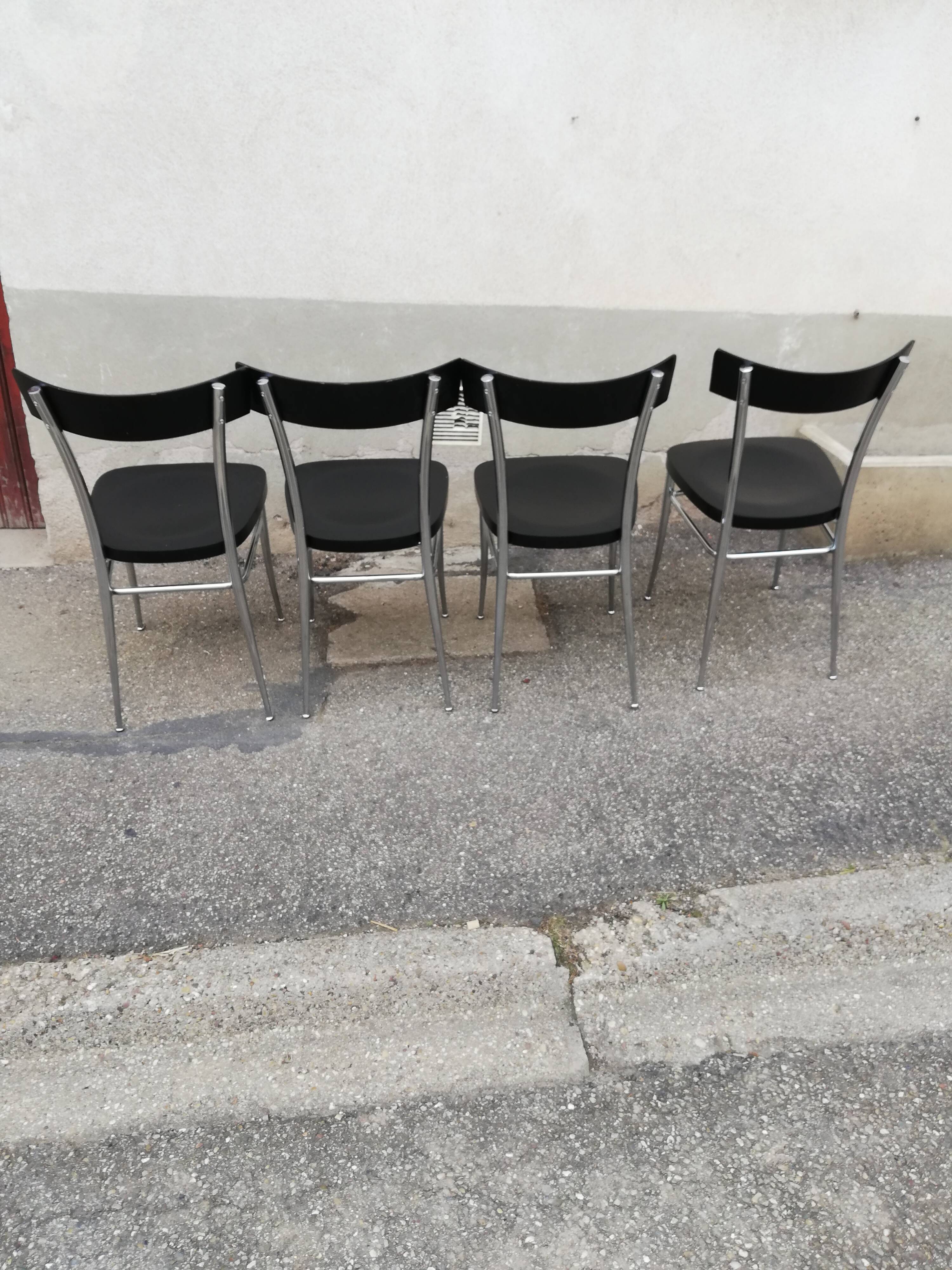 Set of 4 vintage chairs chrome and black wood