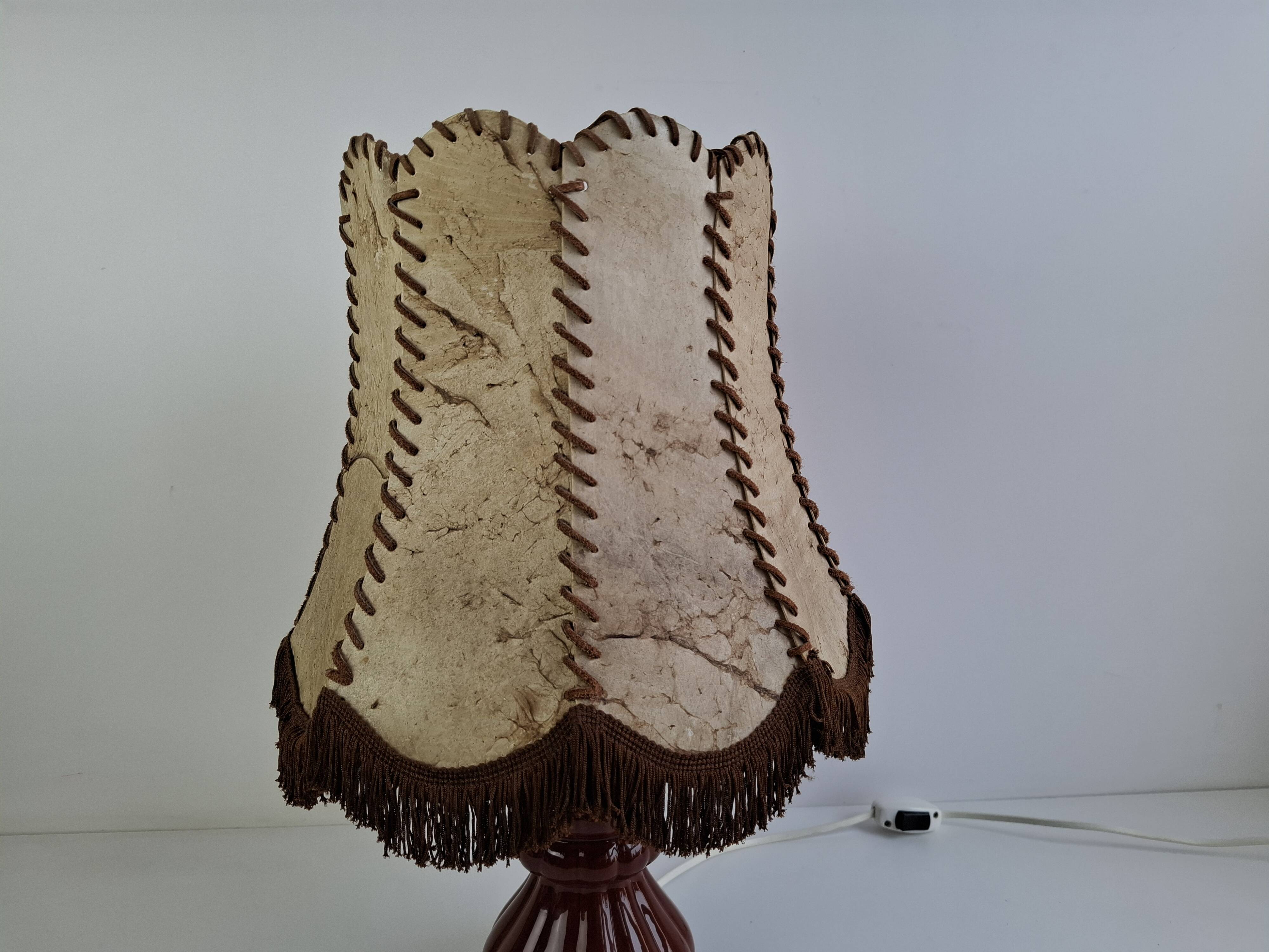 Vintage ceramic table lamp with hand-stitched leather shade, 1980s.