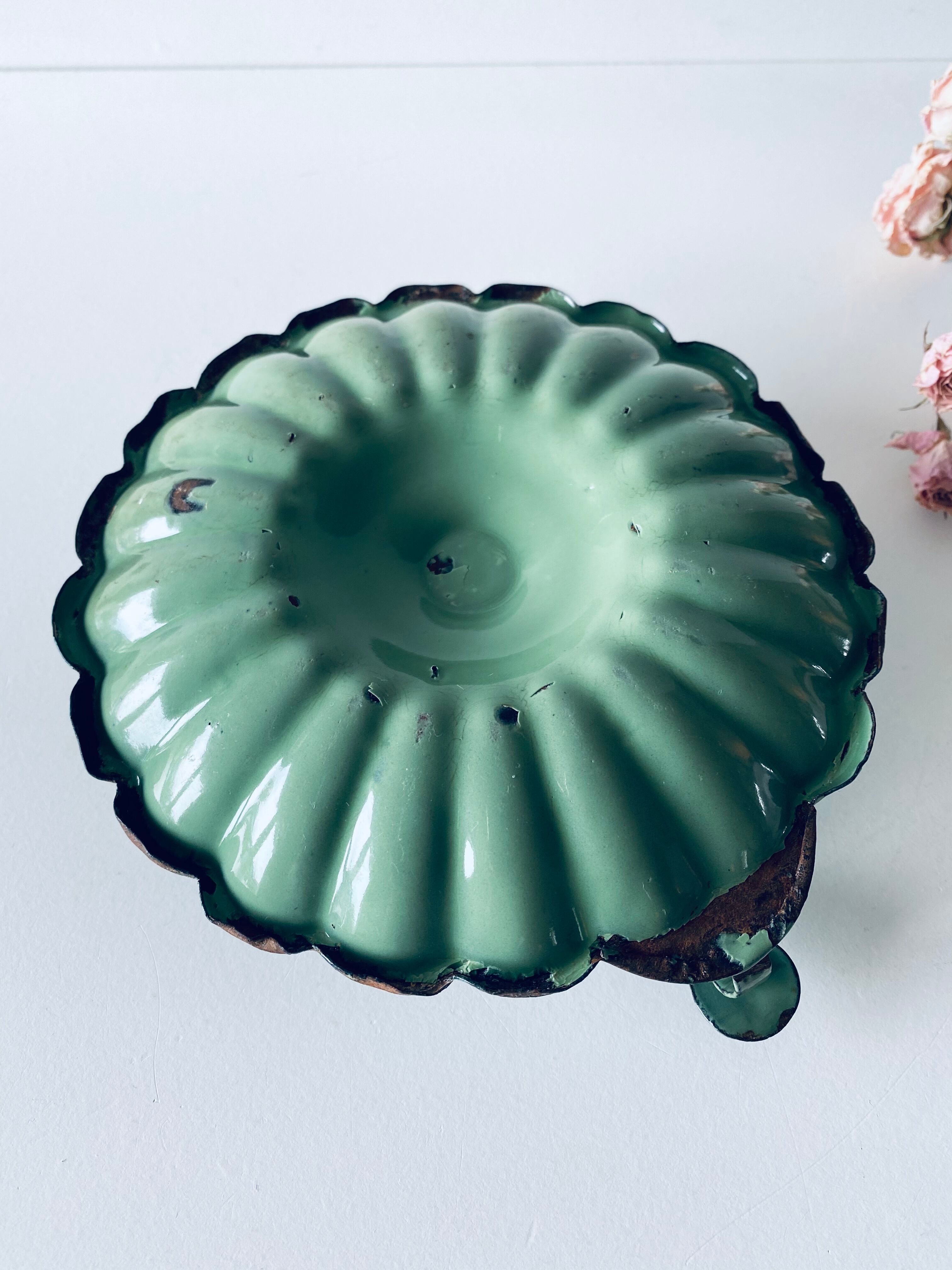 Old antique olive green enamelled metal candlestick