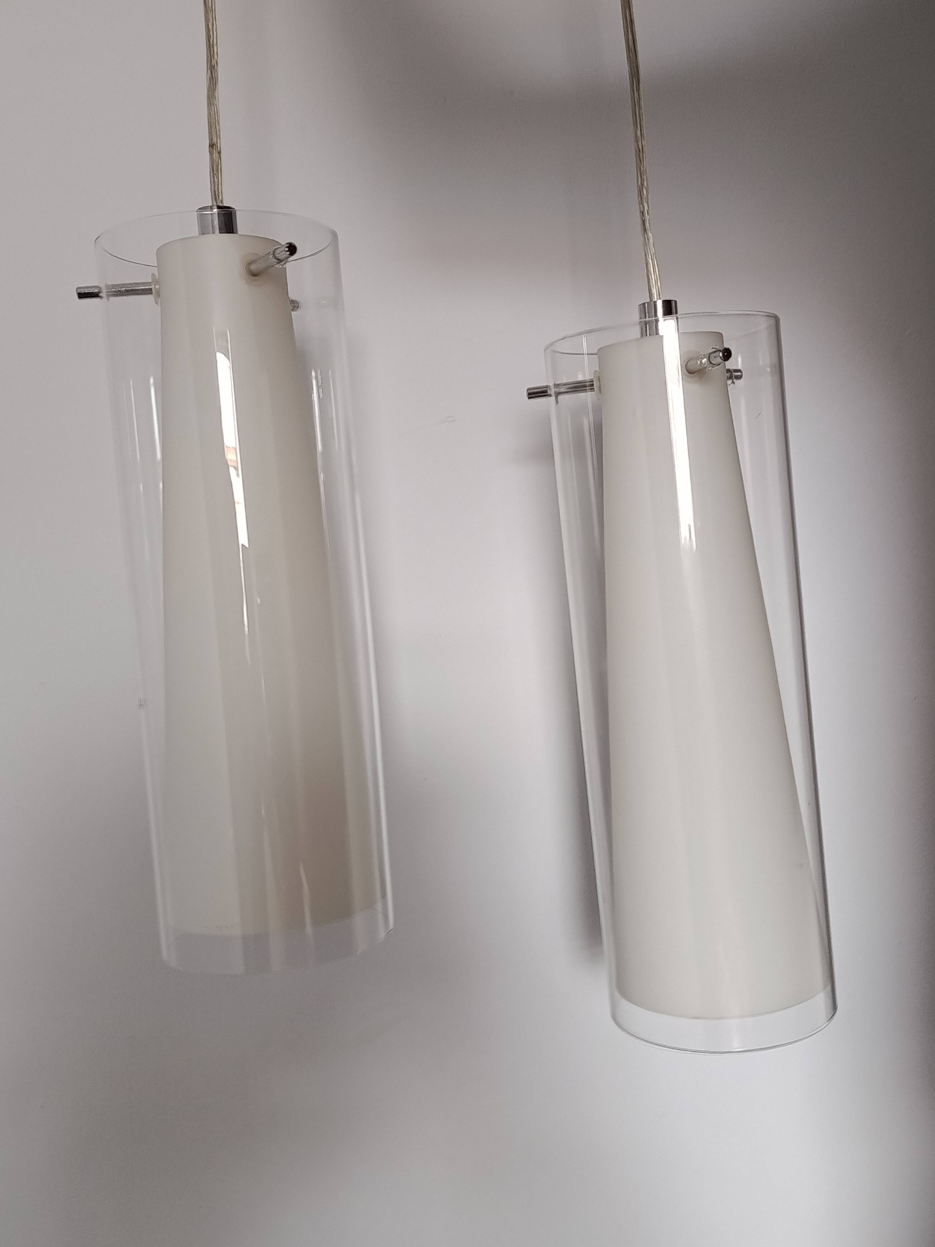 Transparent glass suspensions and white opaline glass inside.