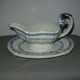 Saucière in Gien earthenware anse in the shape of a dolphin decoration garland 1900