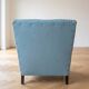 Vintage armchair in light blue faux leather retro style