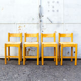 Four wooden and straw stools 70