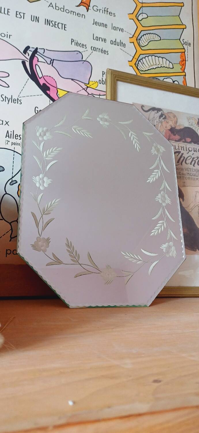 Beveled mirror with floral decor
