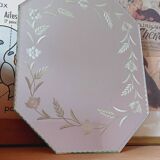 Beveled mirror with floral decor