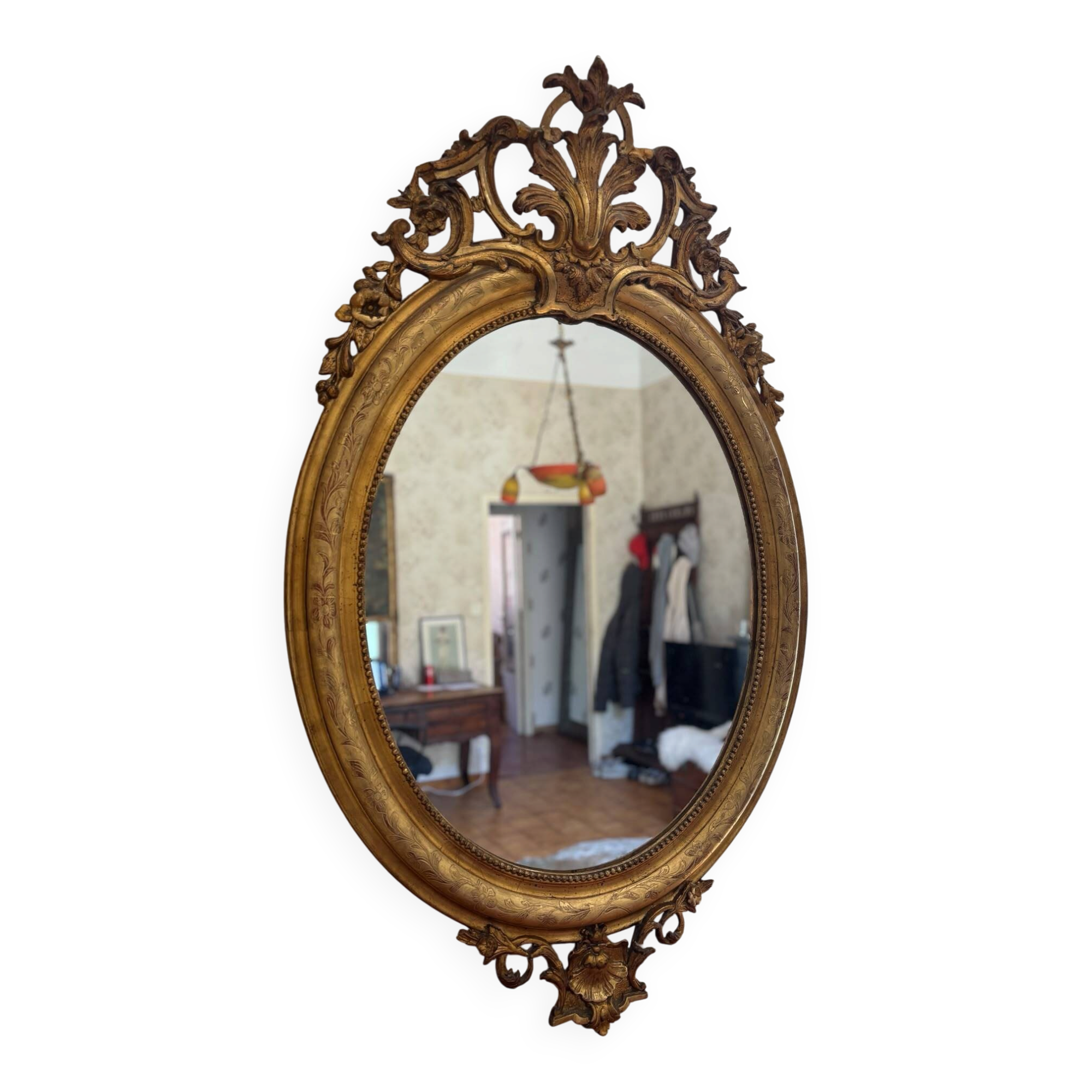 Golden oval mirror