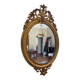 Golden oval mirror