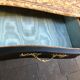 Commode "tombeau" patiné noire style régence