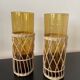Set of 2 smoked orangeade glasses in woven wicker
