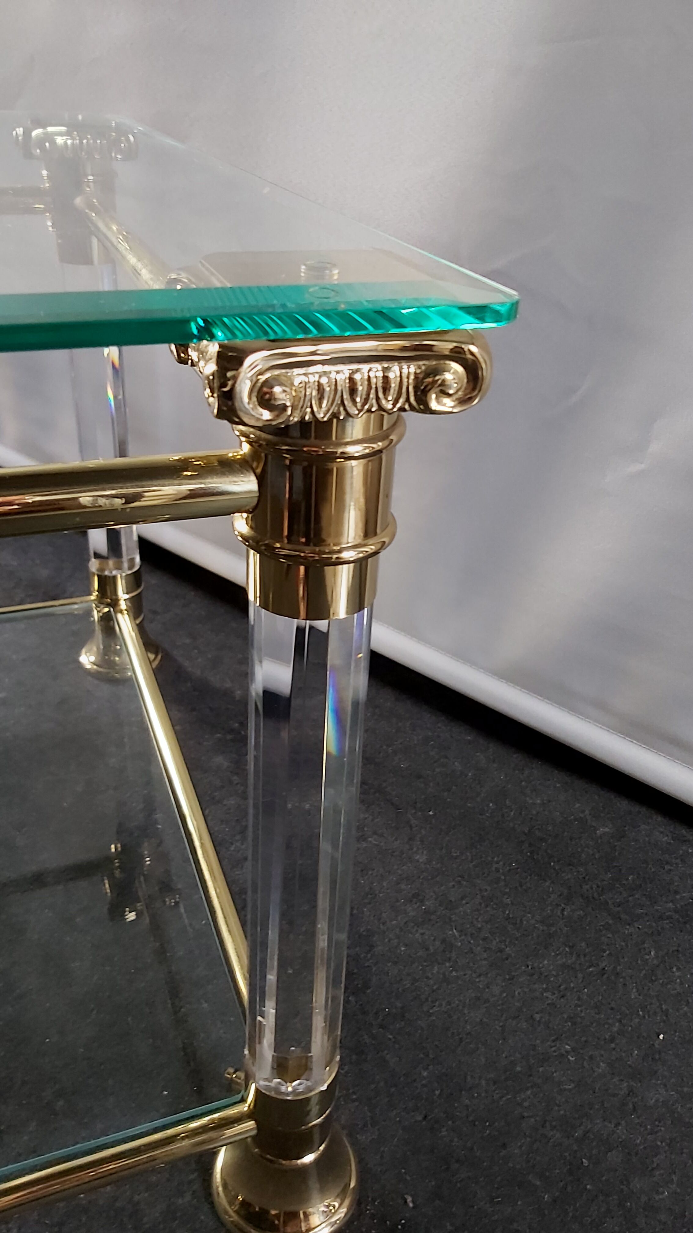 Pair of tables in brass, acrylic and glass