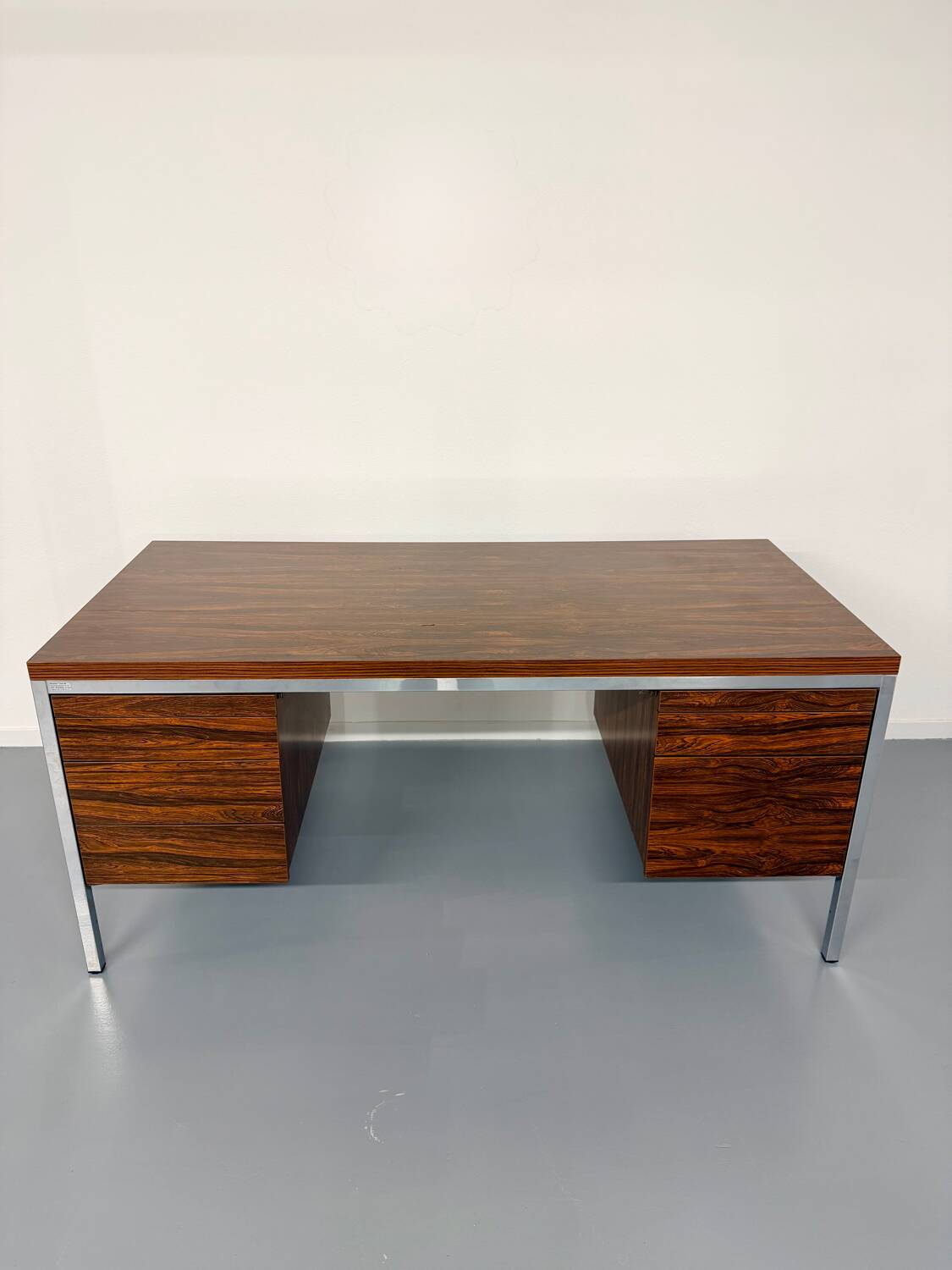 Vintage desk with rosewood veneer and chrome metal design from the 1970s.