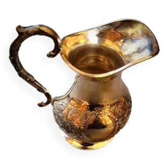 Antique milk jug in silver metal