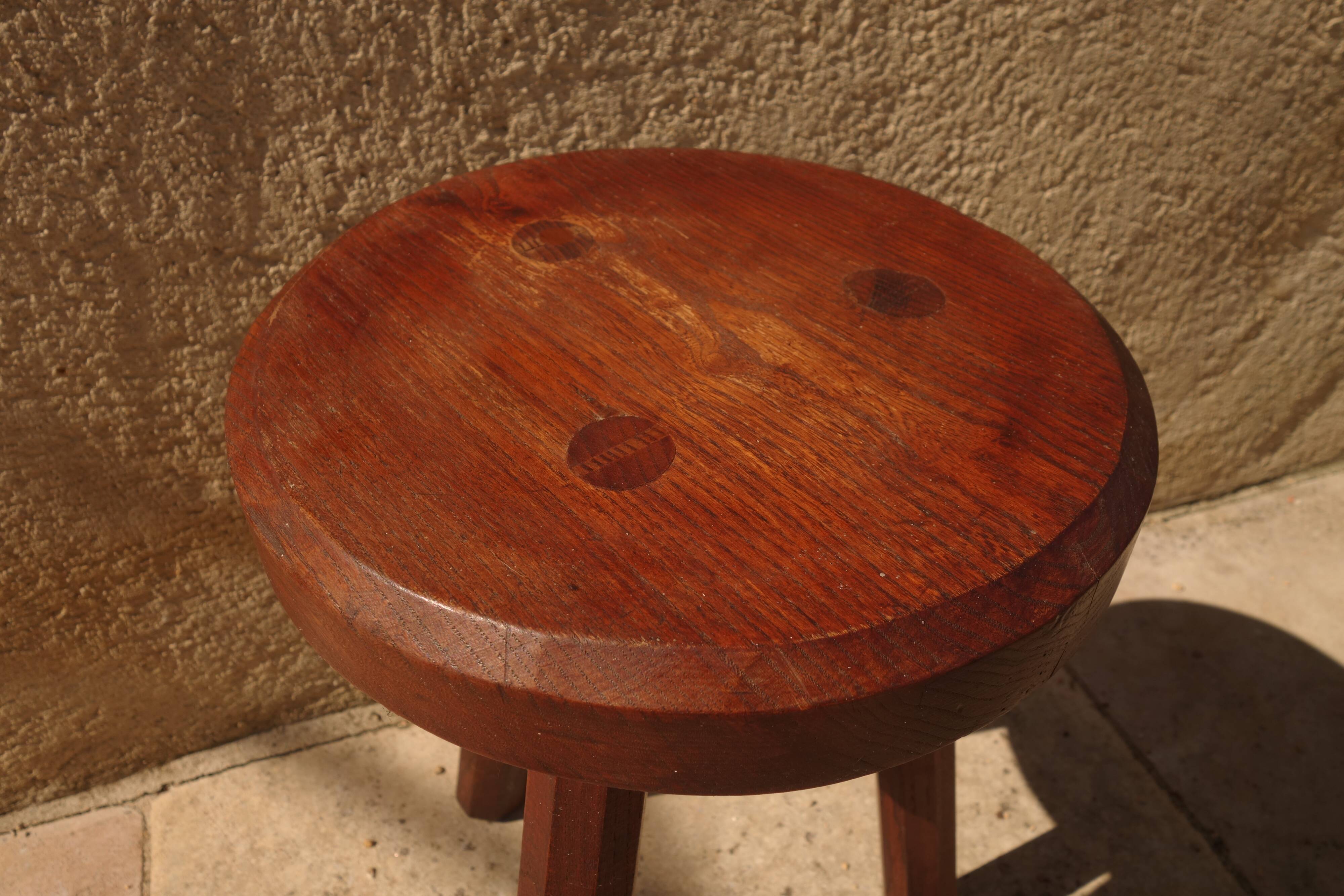 Brutalist tripod stool from the 50s in wood.