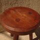 Brutalist tripod stool from the 50s in wood.