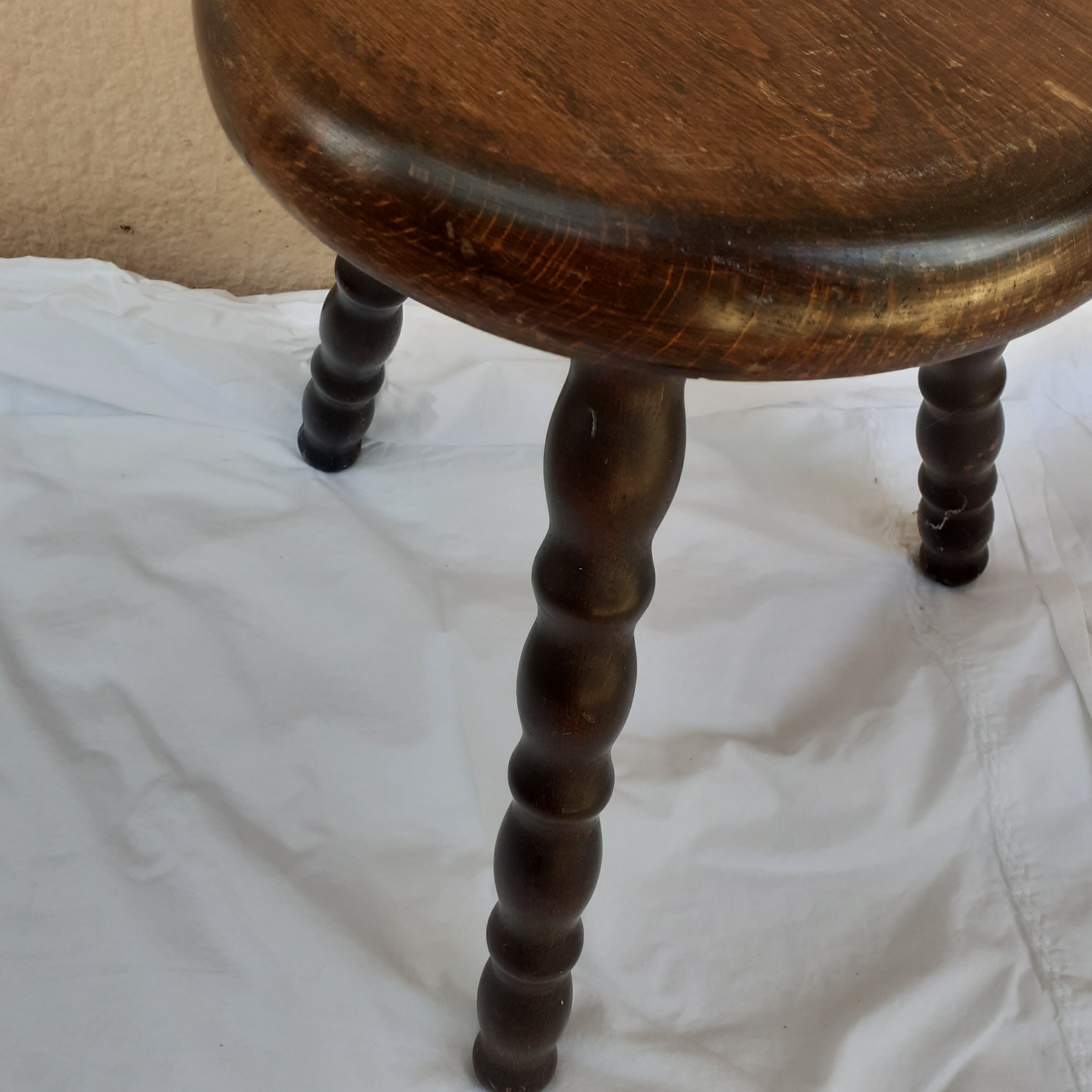 Dark wood tripod stool