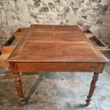 Antique French walnut table with six drawers, parquet top, early 20th century.