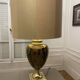 Bronze table lamp with a golden shade.