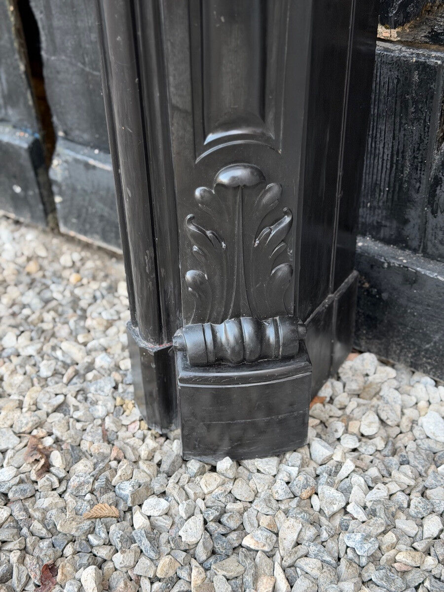 Louis XV style fireplace in black Belgian marble, circa 1880.
