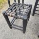 5 blackened wooden stools with woven leather seats by Nina Kaufmann