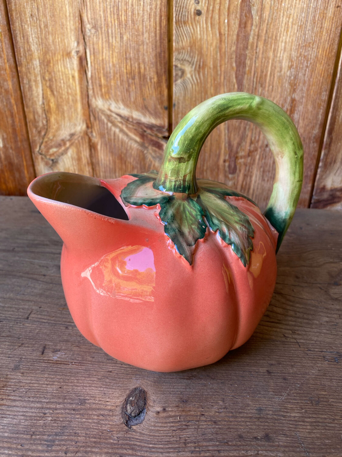 Jug in tomato slipware