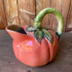 Jug in tomato slipware